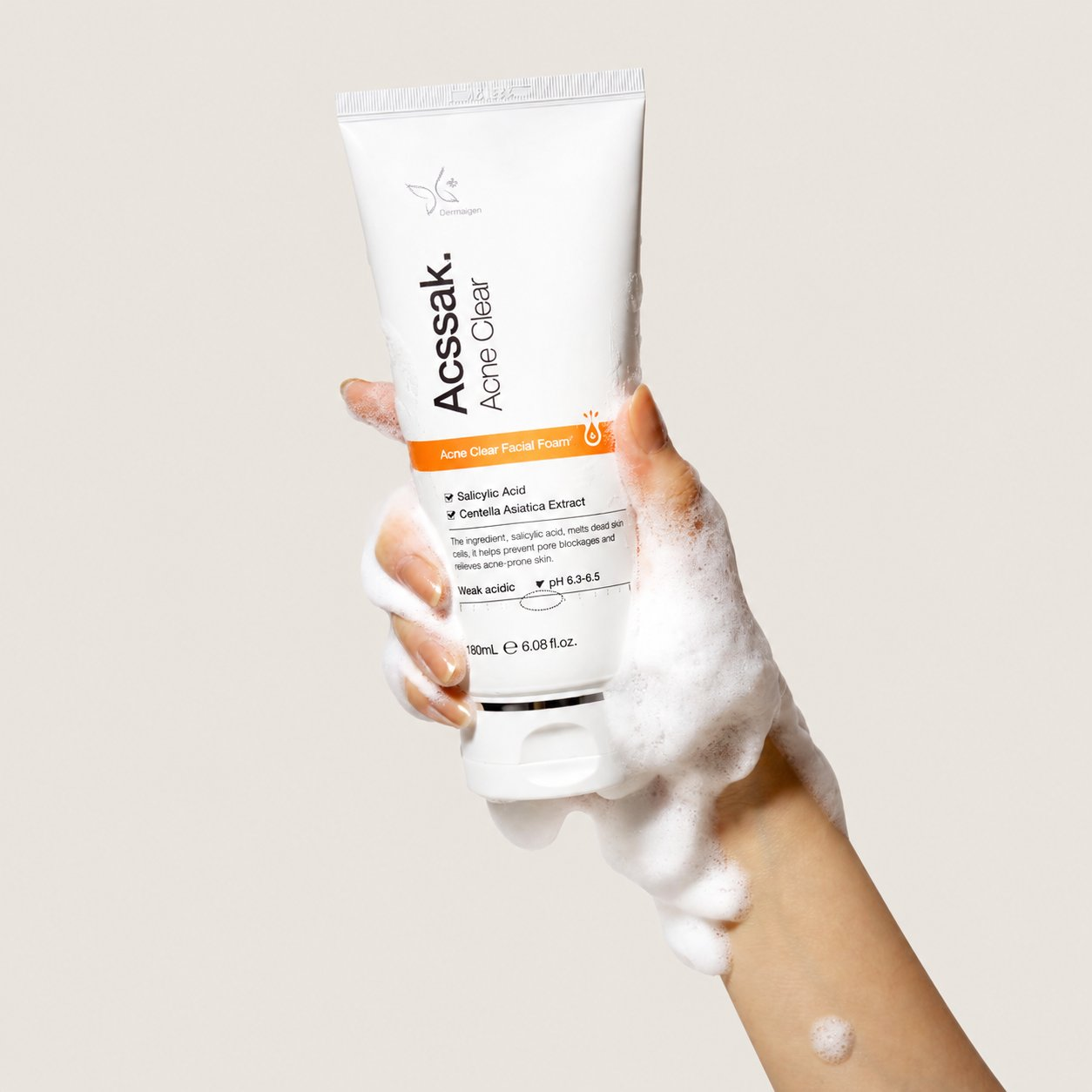 Dermagen Acssak Acne Clear Facial Foam worked into a soft lather, shown in hand