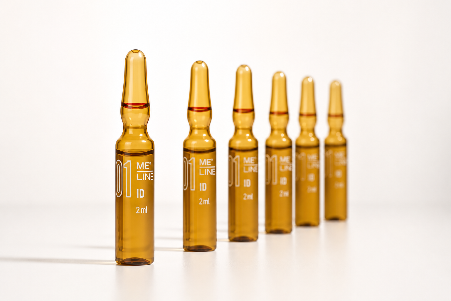 Six amber MELINE 01 ID 2 mL ampoules arranged on a clean white studio surface